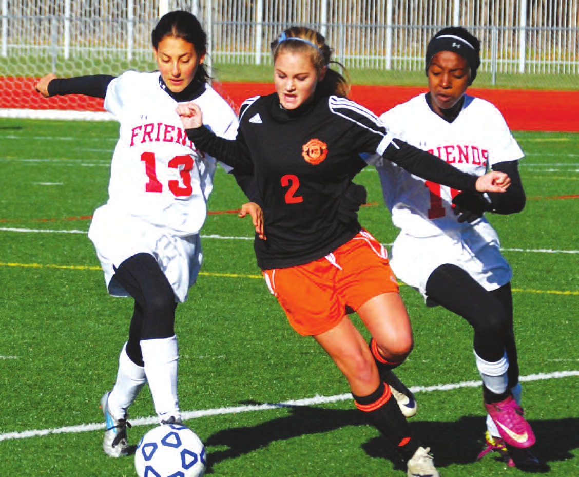 Keshequa sophomore Haley Russell muscles her way ahead of Quakers Melissa Greenblatt and Alexis Toles. Russell scored the second of the Indians goals on the morning.