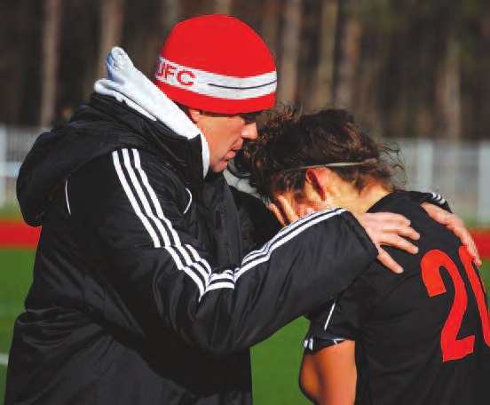Coach Pete Goho consoles emotional captain and senior Gabby DiAngelo after the team's only loss of the season ended Keshequa's hopes of a state title. In a 3-2 semifinal loss against Friends Academy, the Indians allowed as many goals as they did in the previous 21 games.